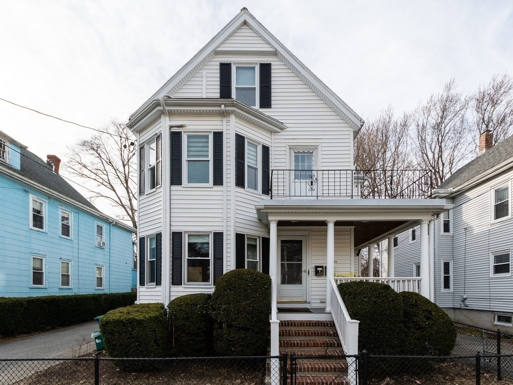 31 Gorham Street, Unit B Somerville, MA 02144 - Photo 33 of 36 a front view of a house with a yard