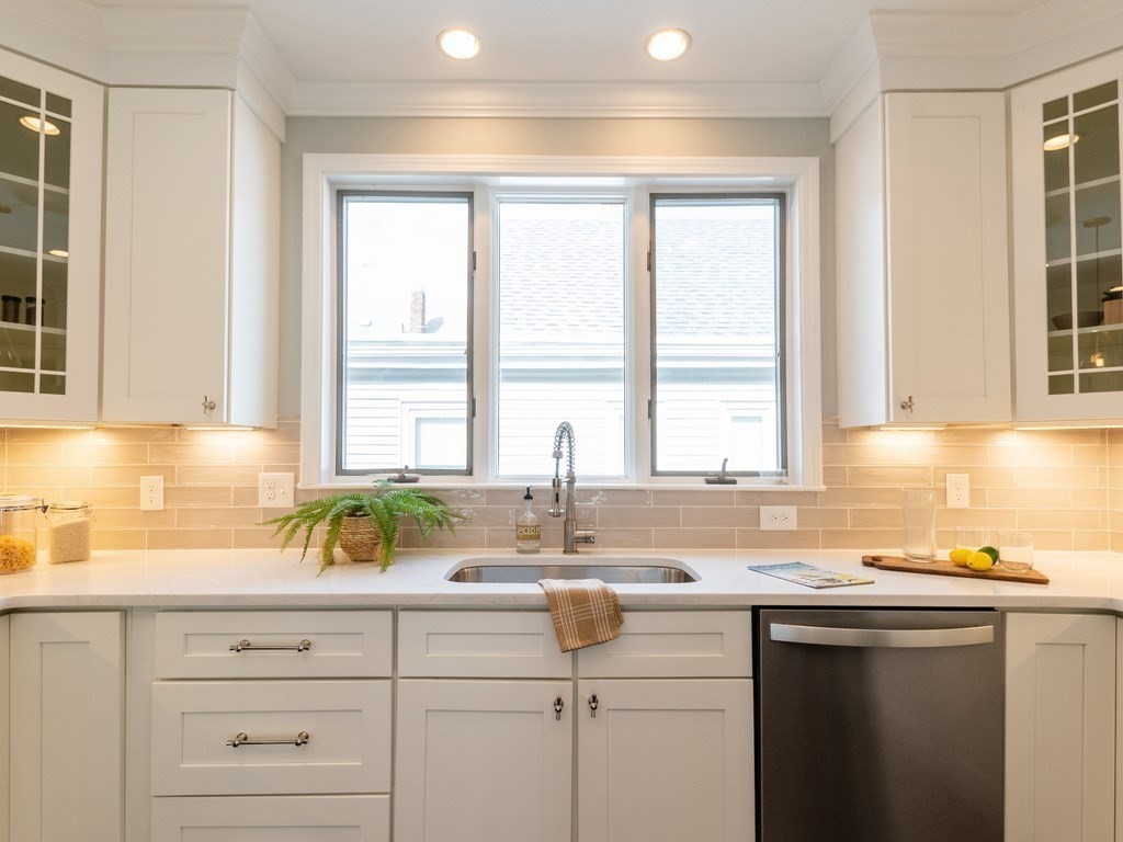 31 Gorham Street, Unit B Somerville, MA 02144 - Photo 4 of 36 a kitchen with sink a window and cabinets