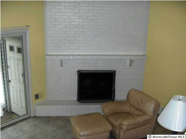 2 Village Road Sea Bright, NJ 07760 - Photo 3 of 3 a living room with furniture and a fireplace