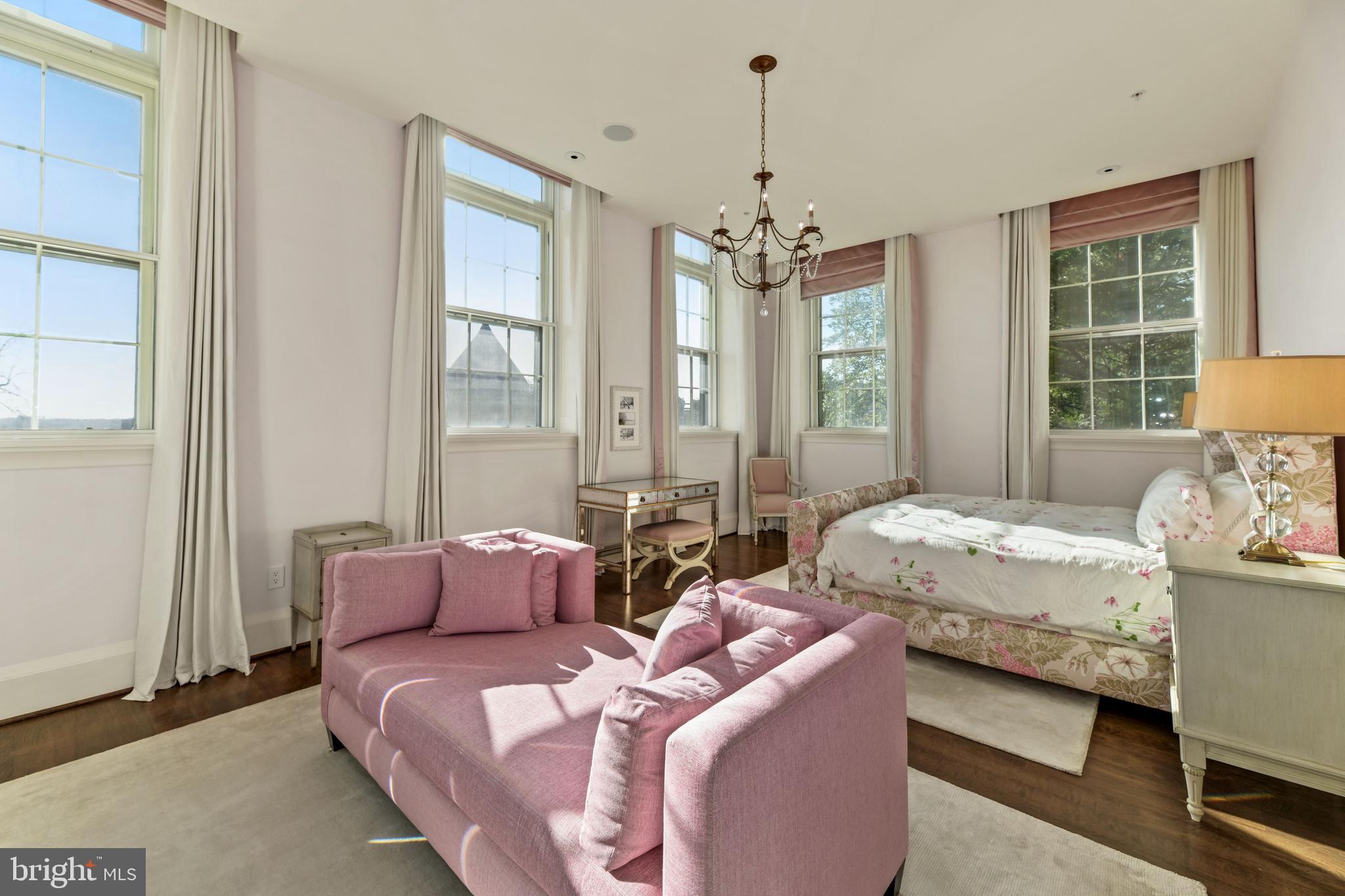 3329 Prospect Street Northwest, Unit 7 Washington, DC 20007 - Photo 17 of 50 a bedroom with two beds and a chandelier