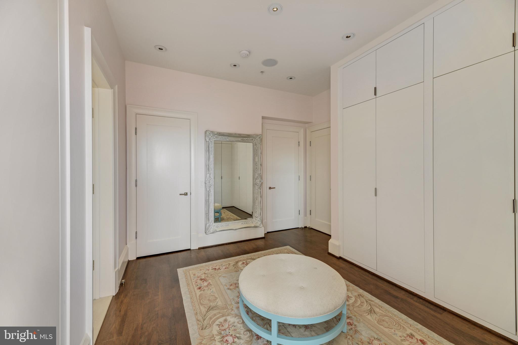 3329 Prospect Street Northwest, Unit 7 Washington, DC 20007 - Photo 19 of 50 a bathroom with a granite countertop sink a mirror and a toilet