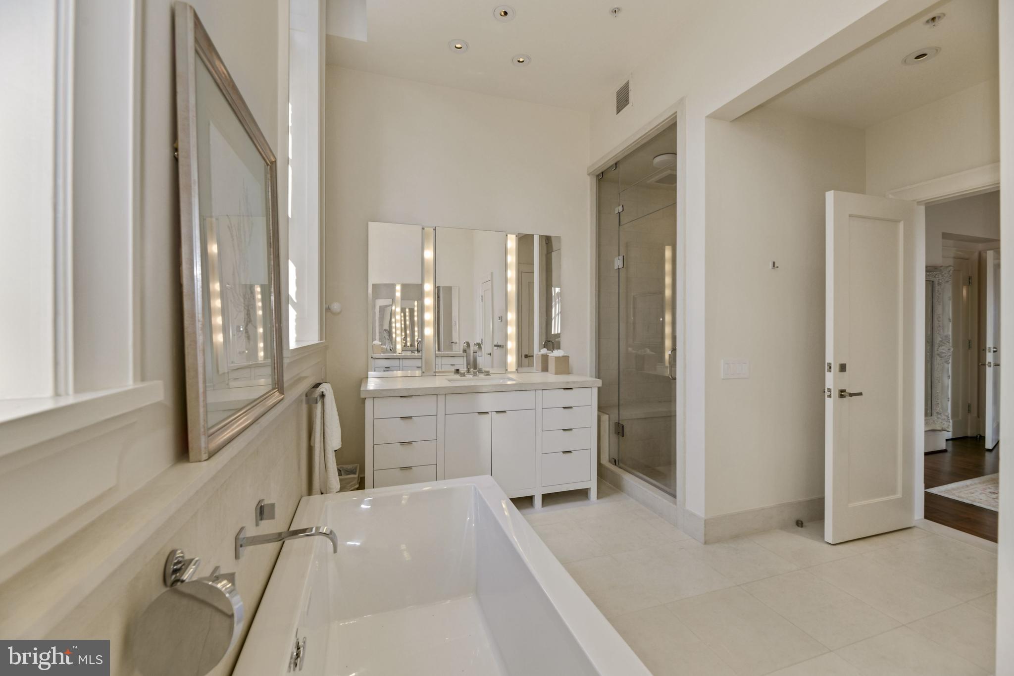 3329 Prospect Street Northwest, Unit 7 Washington, DC 20007 - Photo 24 of 50 a room with a bed and a view of bathroom