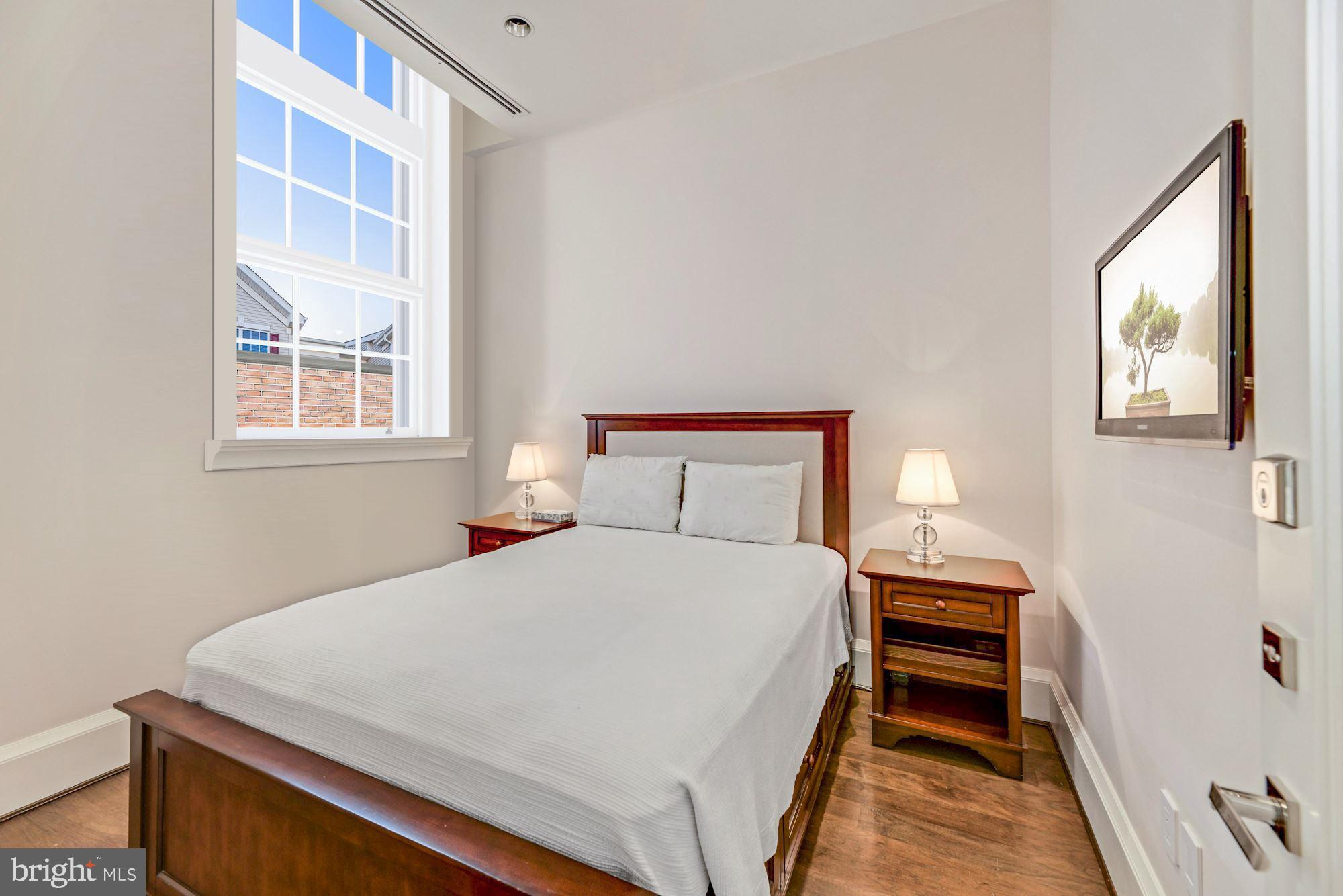 3329 Prospect Street Northwest, Unit 7 Washington, DC 20007 - Photo 25 of 50 a bedroom with a bed and a large window