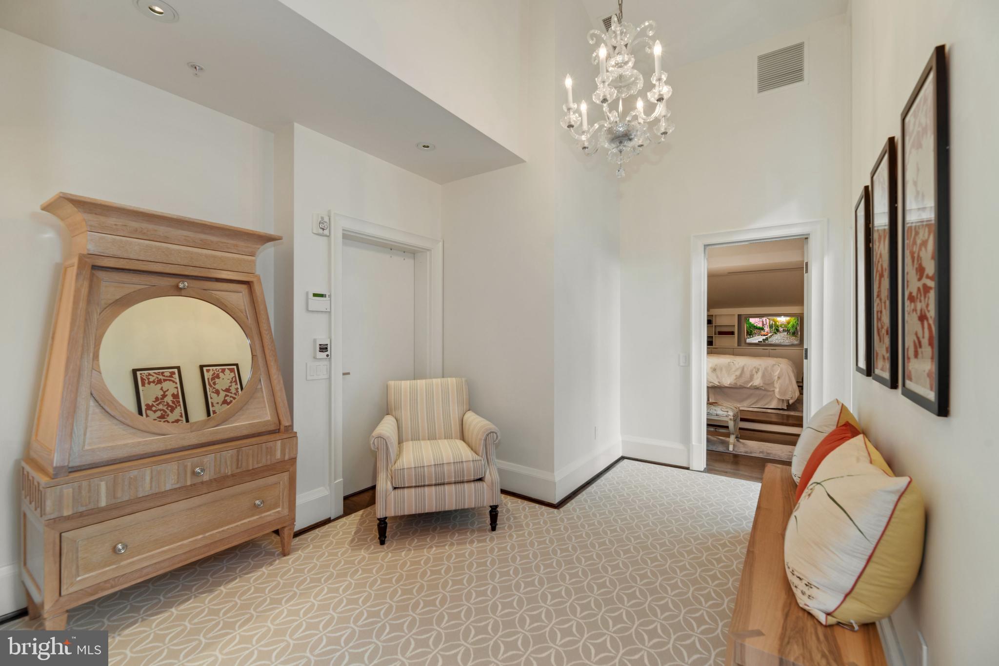 3329 Prospect Street Northwest, Unit 7 Washington, DC 20007 - Photo 28 of 50 a living room with furniture and a chandelier
