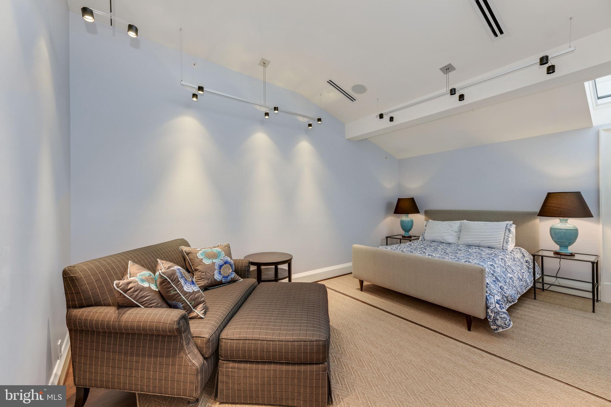 3329 Prospect Street Northwest, Unit 7 Washington, DC 20007 - Photo 34 of 50 a bedroom with bed and a couch