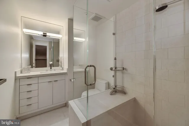 a bathroom with a sink and mirror