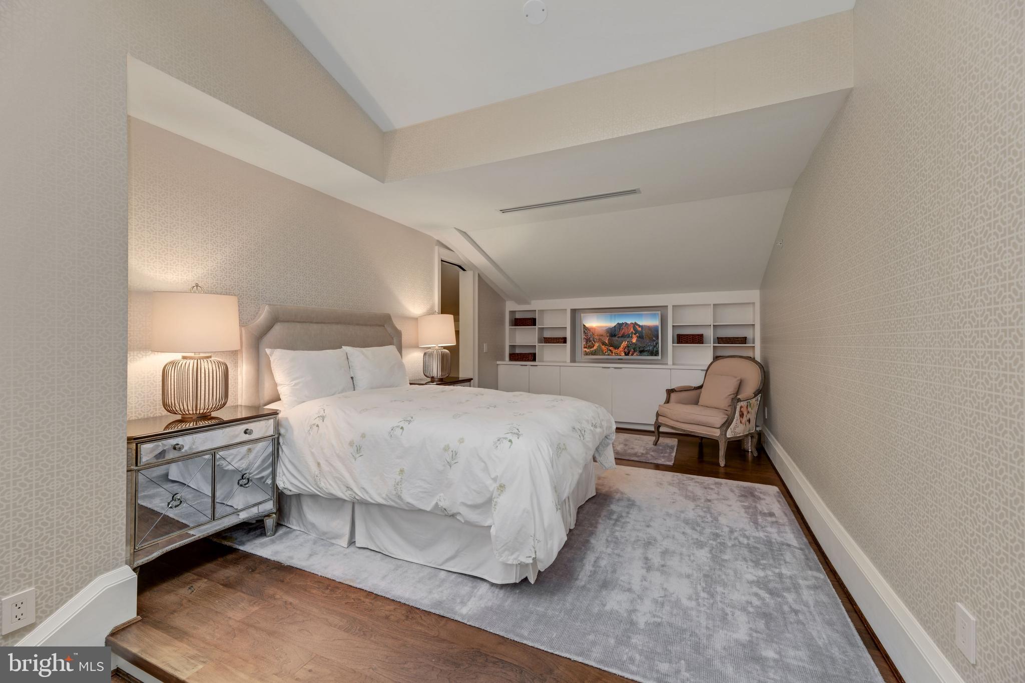 3329 Prospect Street Northwest, Unit 7 Washington, DC 20007 - Photo 37 of 50 a spacious bedroom with a bed and a lamp