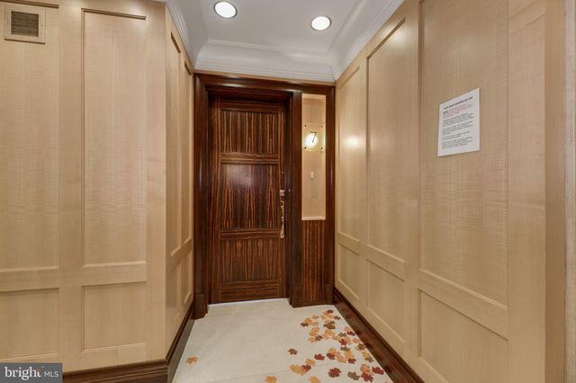 a view of hallway with wooden floor