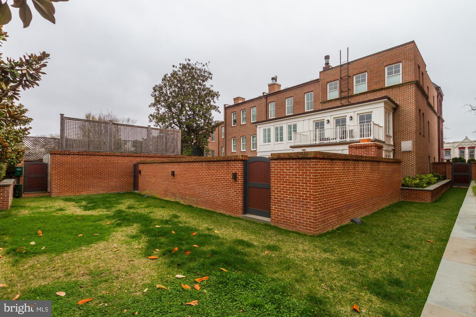 3329 Prospect Street Northwest, Unit 7 Washington, DC 20007 - Photo 47 of 50 a front view of a house with a yard