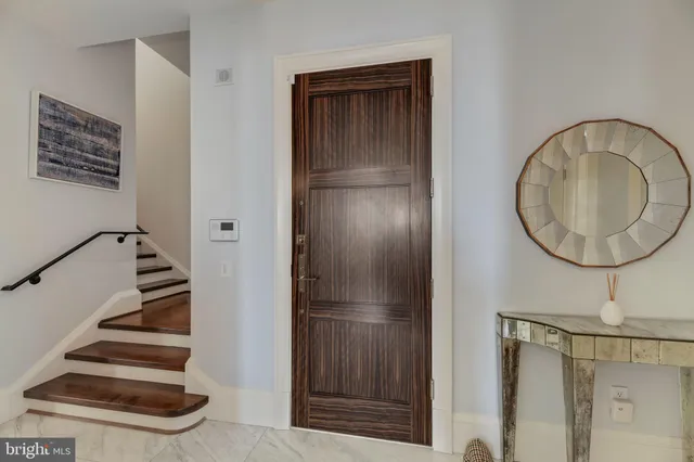 a bathroom with a mirror and a shower
