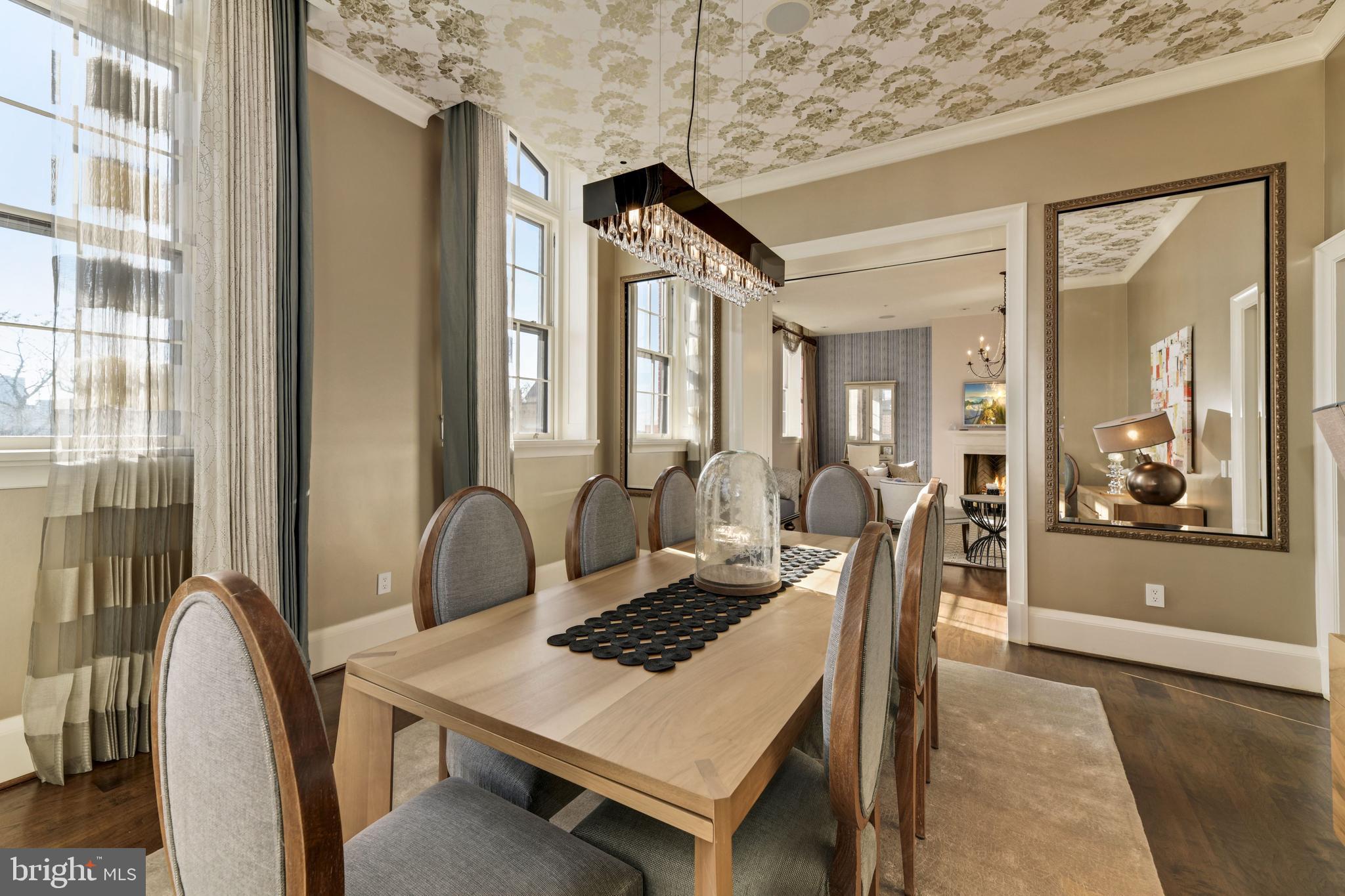 3329 Prospect Street Northwest, Unit 7 Washington, DC 20007 - Photo 9 of 50 a dining room with a wooden table and chairs