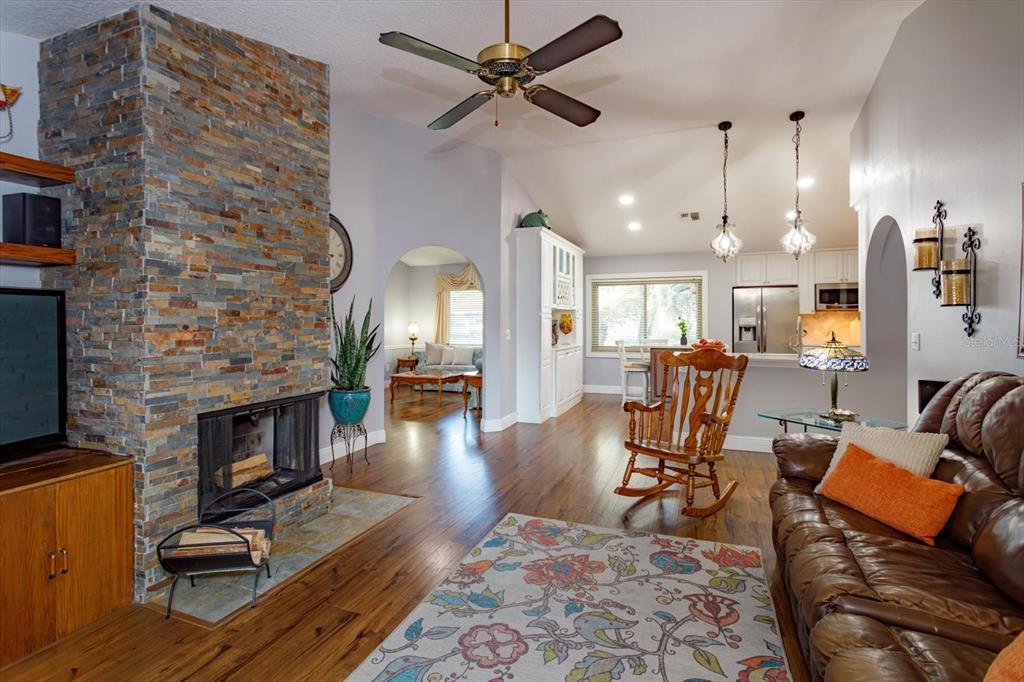 9237 Sabal Palm Circle Windermere, FL 34786 - Photo 11 of 44 a living room with furniture fireplace and dining table