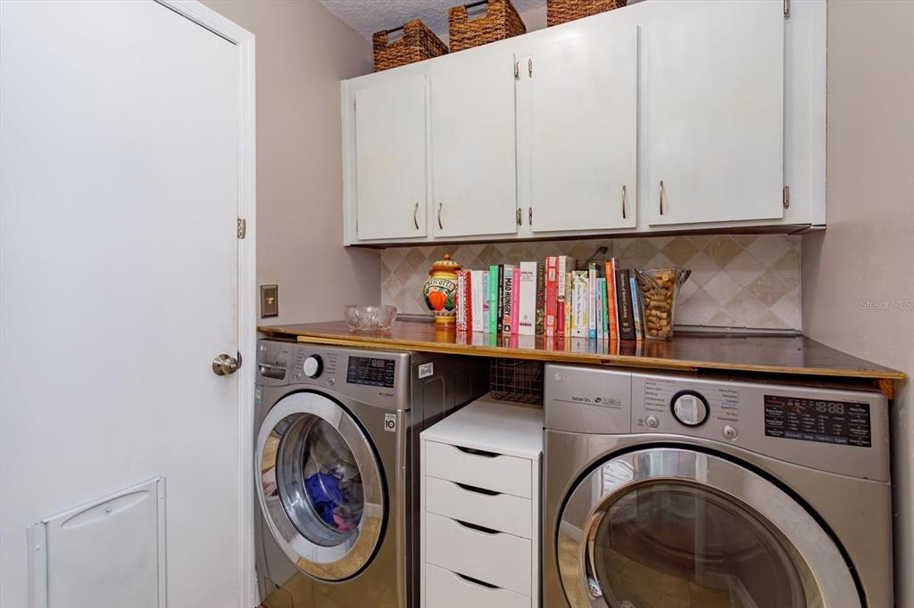 9237 Sabal Palm Circle Windermere, FL 34786 - Photo 18 of 44 a utility room with dryer and washer