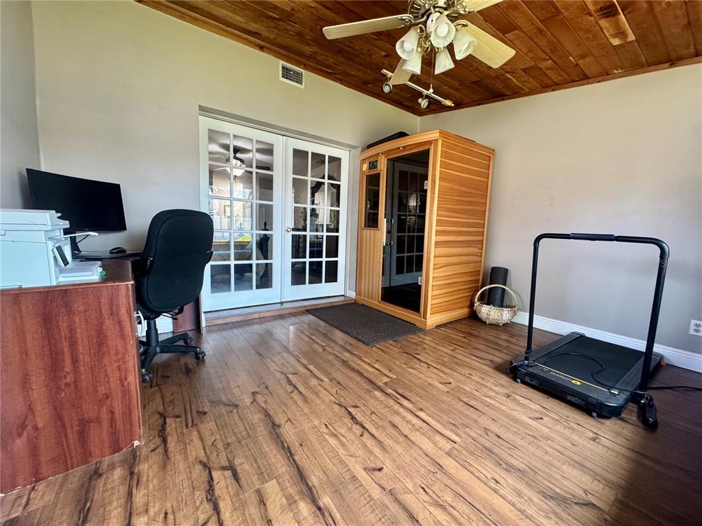 9237 Sabal Palm Circle Windermere, FL 34786 - Photo 26 of 44 a work room with furniture and wooden floor