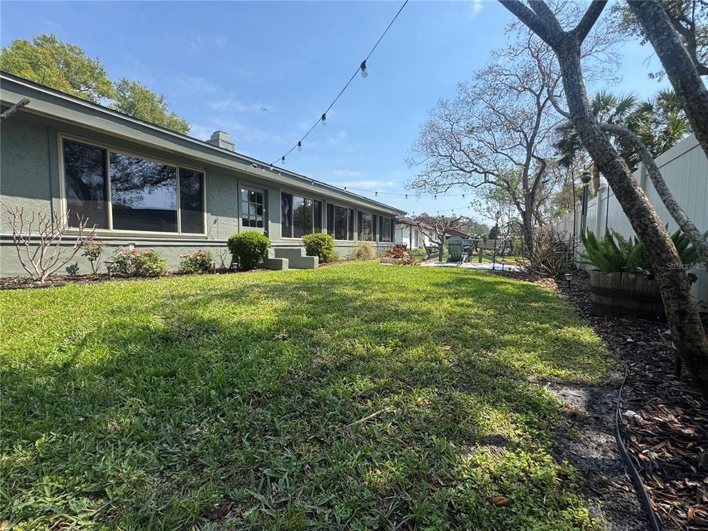 9237 Sabal Palm Circle Windermere, FL 34786 - Photo 42 of 44 a view of a house with a yard