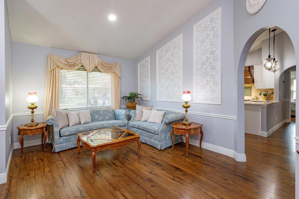 9237 Sabal Palm Circle Windermere, FL 34786 - Photo 7 of 44 a living room with furniture and wooden floor