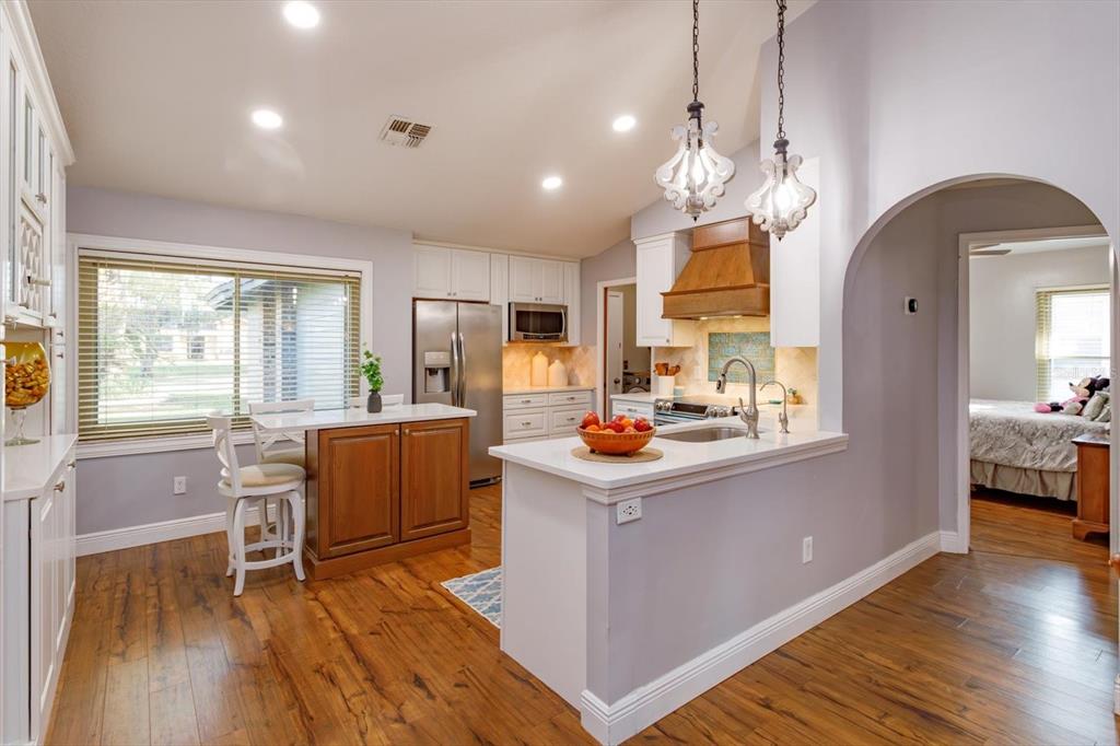 9237 Sabal Palm Circle Windermere, FL 34786 - Photo 8 of 44 a view of kitchen and dining room with wooden floor
