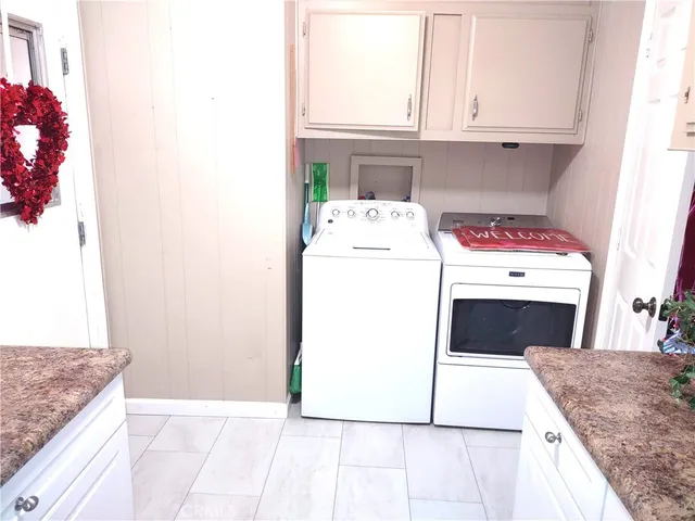 a utility room with washer and dryer