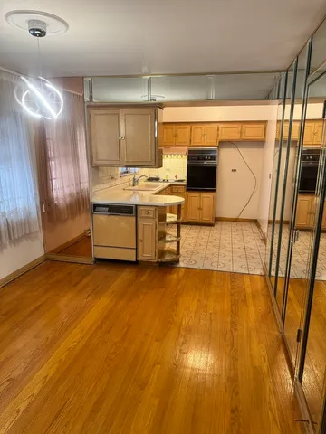 a view of a kitchen with a sink and dishwasher
