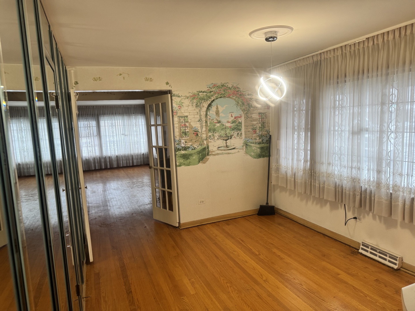 8900 South Prairie Avenue Chicago, IL 60619 - Photo 5 of 18 a view of a room with wooden floor