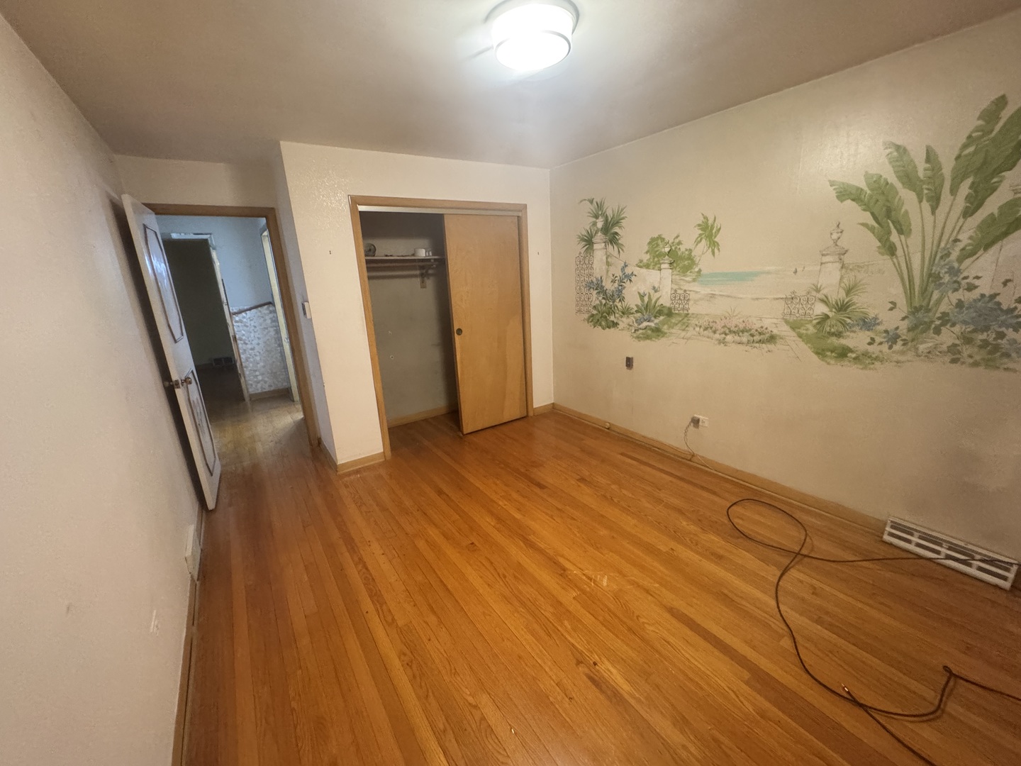 8900 South Prairie Avenue Chicago, IL 60619 - Photo 9 of 18 a view of a room with wooden floor and walls