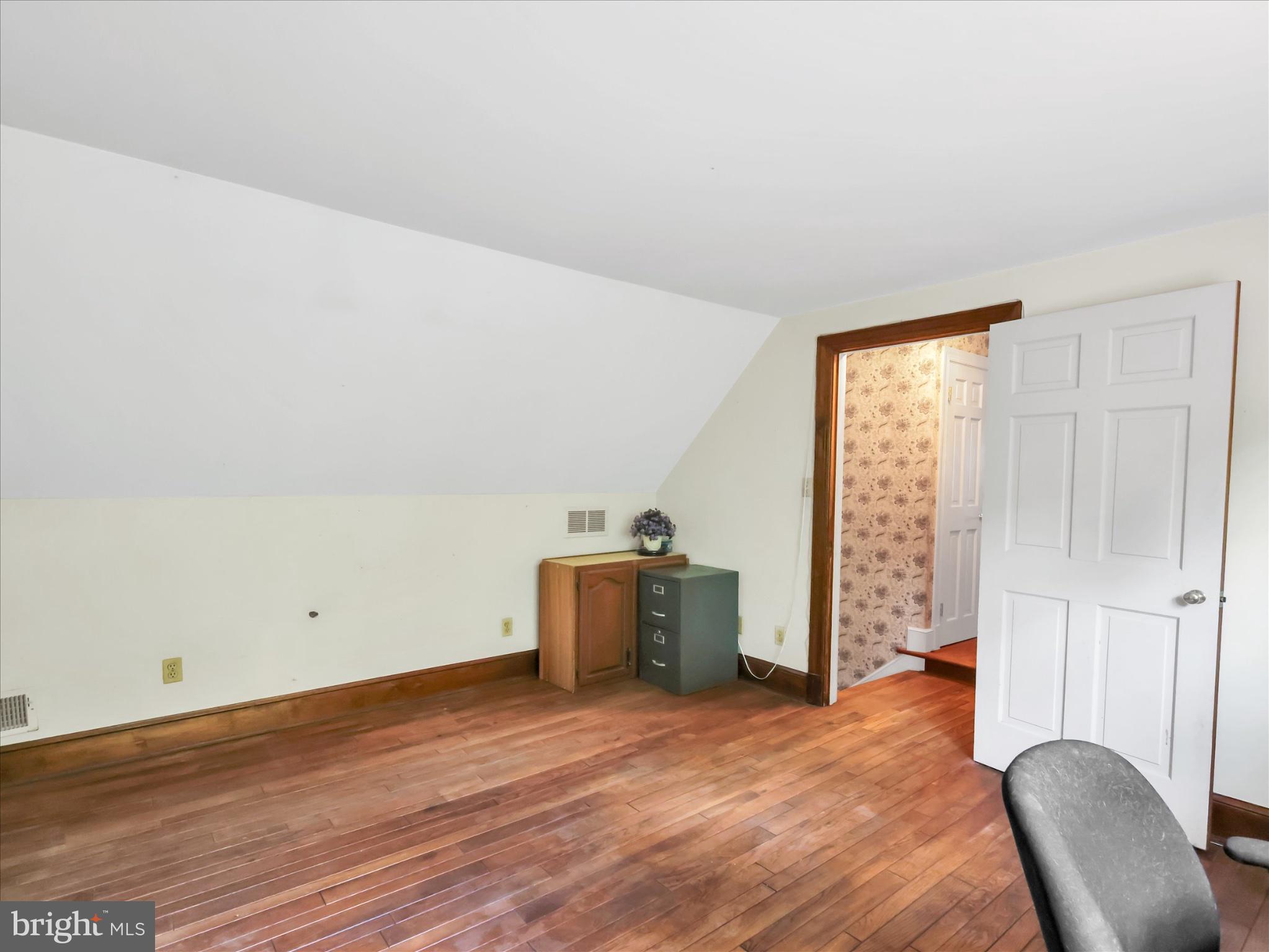 19255 Telegraph Springs Road Purcellville, VA 20132 - Photo 73 of 107 a view of a room with wooden floor and furniture