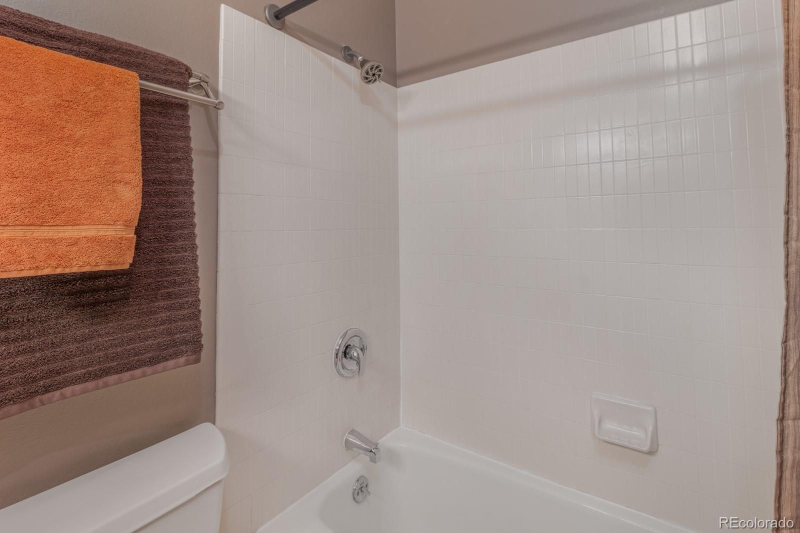 1625 Larimer Street, Unit 801 Denver, CO 80202 - Photo 13 of 33 a bathroom with a bathtub and a shower