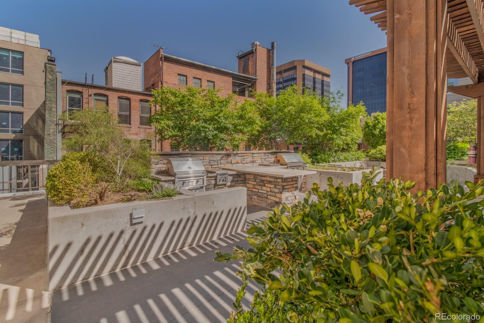 1625 Larimer Street, Unit 801 Denver, CO 80202 - Photo 20 of 33 a front view of a house with a yard