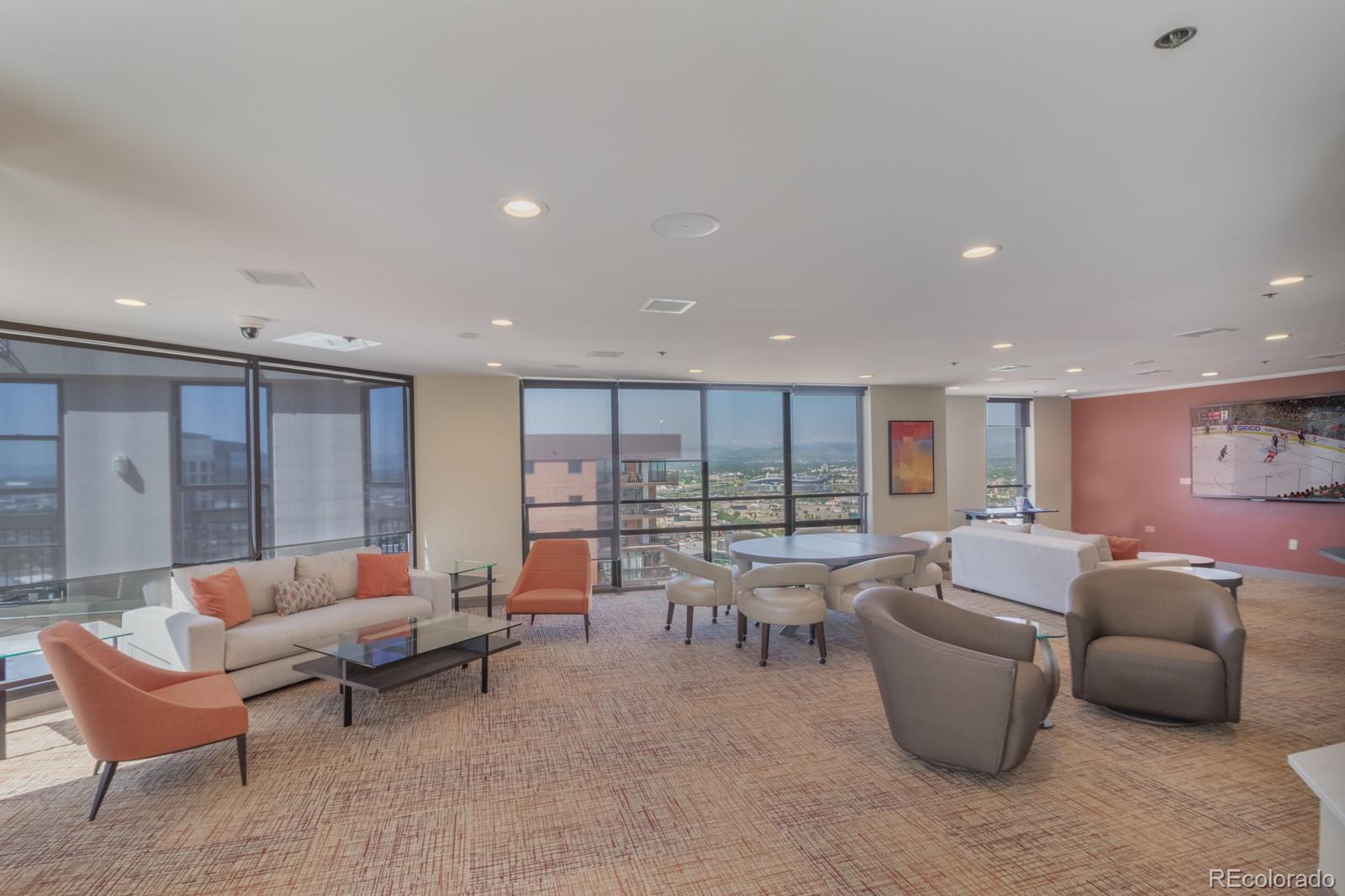 1625 Larimer Street, Unit 801 Denver, CO 80202 - Photo 23 of 33 a living room with furniture and large windows