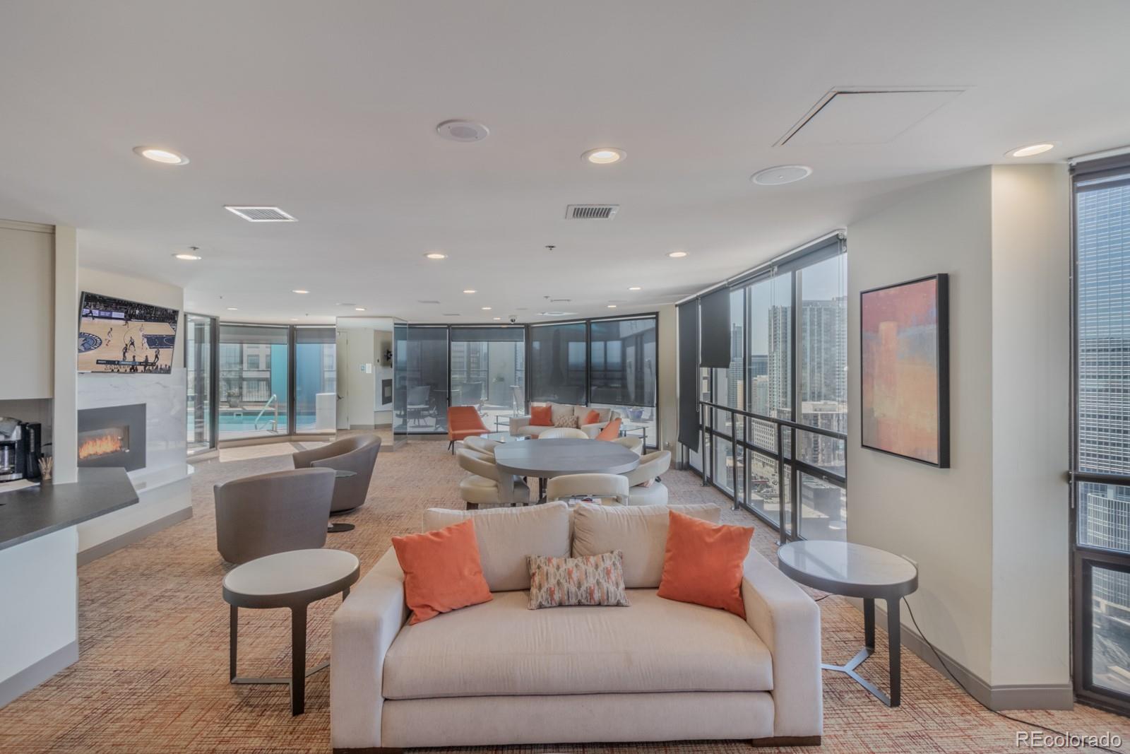 1625 Larimer Street, Unit 801 Denver, CO 80202 - Photo 24 of 33 a living room with furniture and a large window
