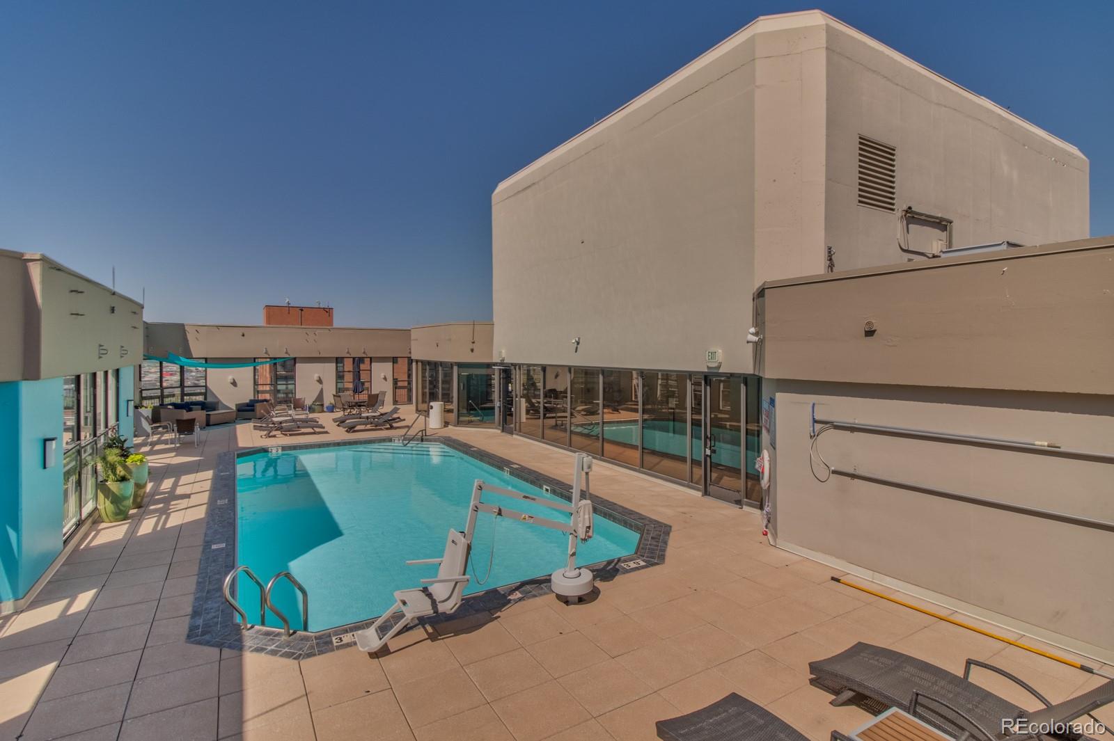 1625 Larimer Street, Unit 801 Denver, CO 80202 - Photo 29 of 33 a terrace with outdoor seating and barbeque oven