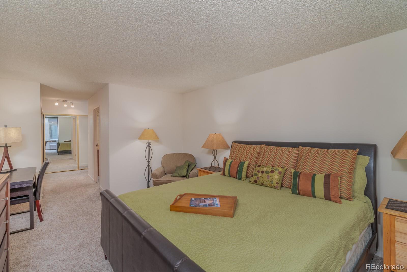 1625 Larimer Street, Unit 801 Denver, CO 80202 - Photo 9 of 33 a living room with furniture and a table