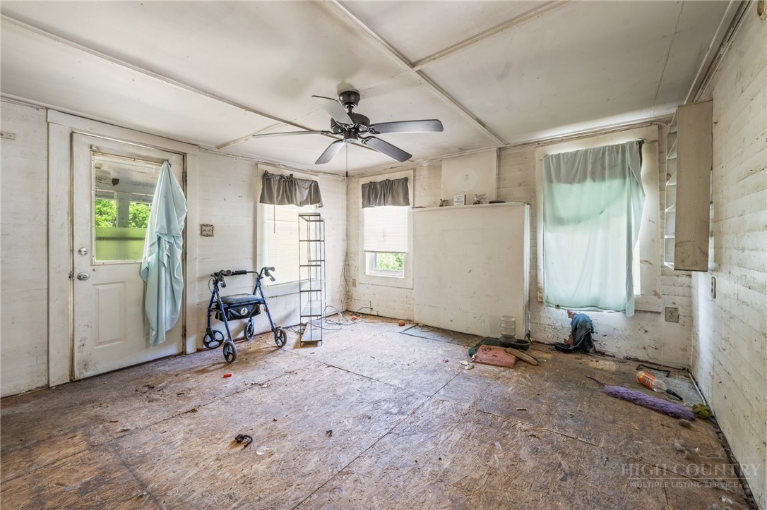 657 Lawrence Greene Road Deep Gap, NC 28618 - Photo 20 of 25 a view of a livingroom with furniture and a window