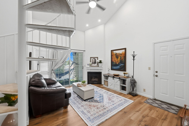650 South Main Street, Unit 3304 Bountiful, UT 84010 - Photo 3 of 22 Living area featuring a spiral staircase, high vaulted ceilings, and wood-finish flooring