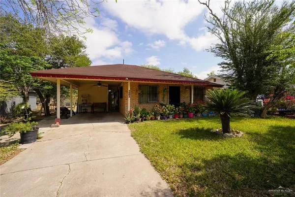 a view of a house with garden and porch