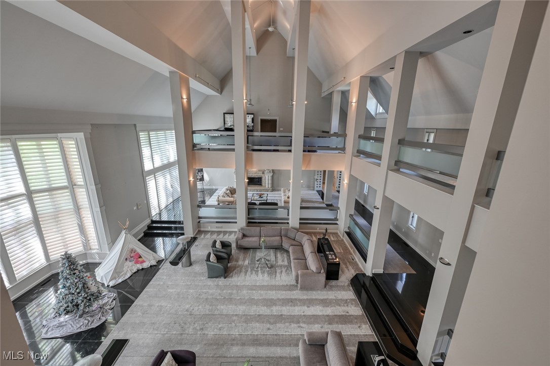 4950 West Streetsboro Road Richfield, OH 44286 - Photo 8 of 27 Living room featuring high vaulted ceiling and beam ceiling