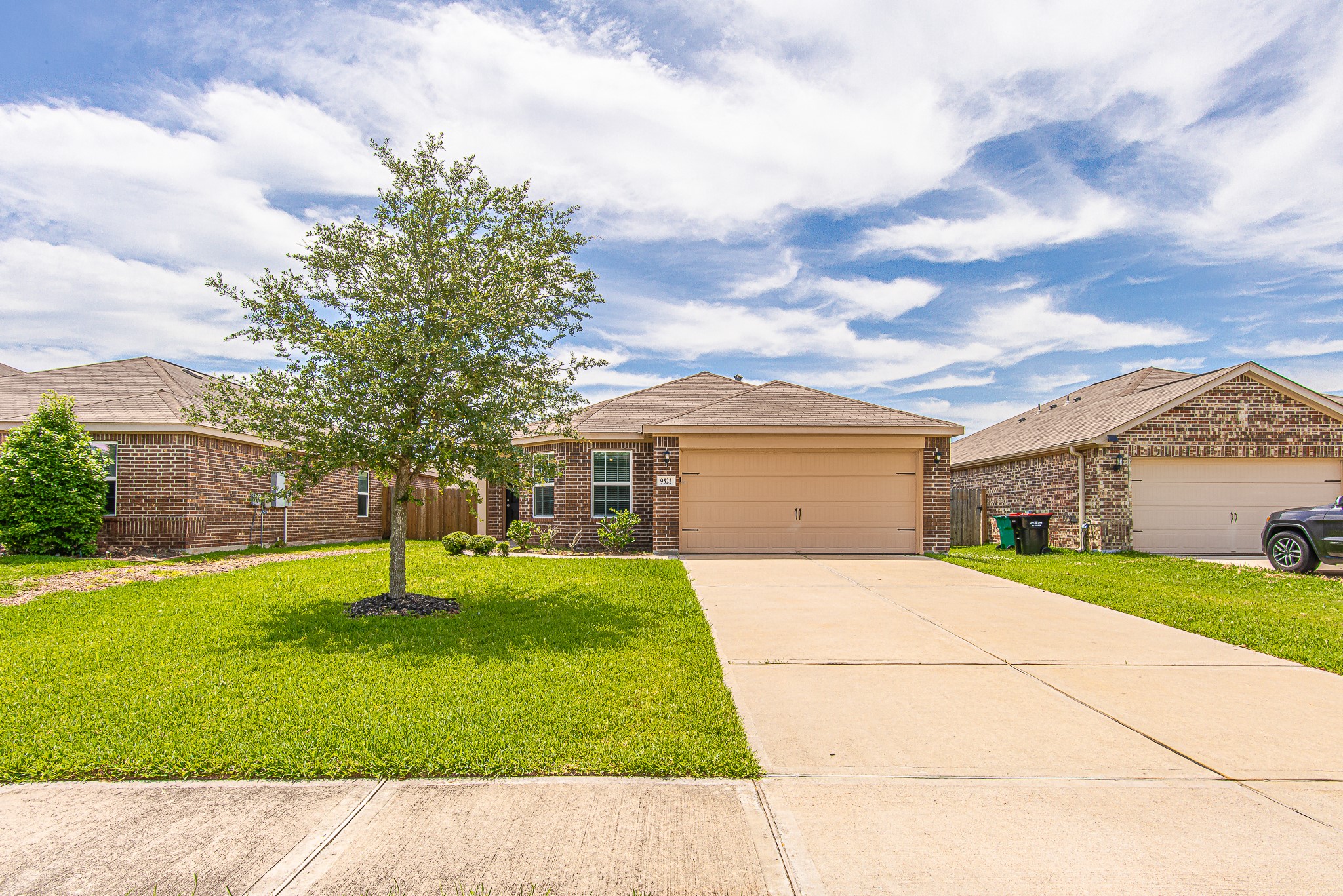 9522 Olive Stone Drive Rosharon, TX 77583 - Photo 1 of 29 a backyard of a house with a yard and garage