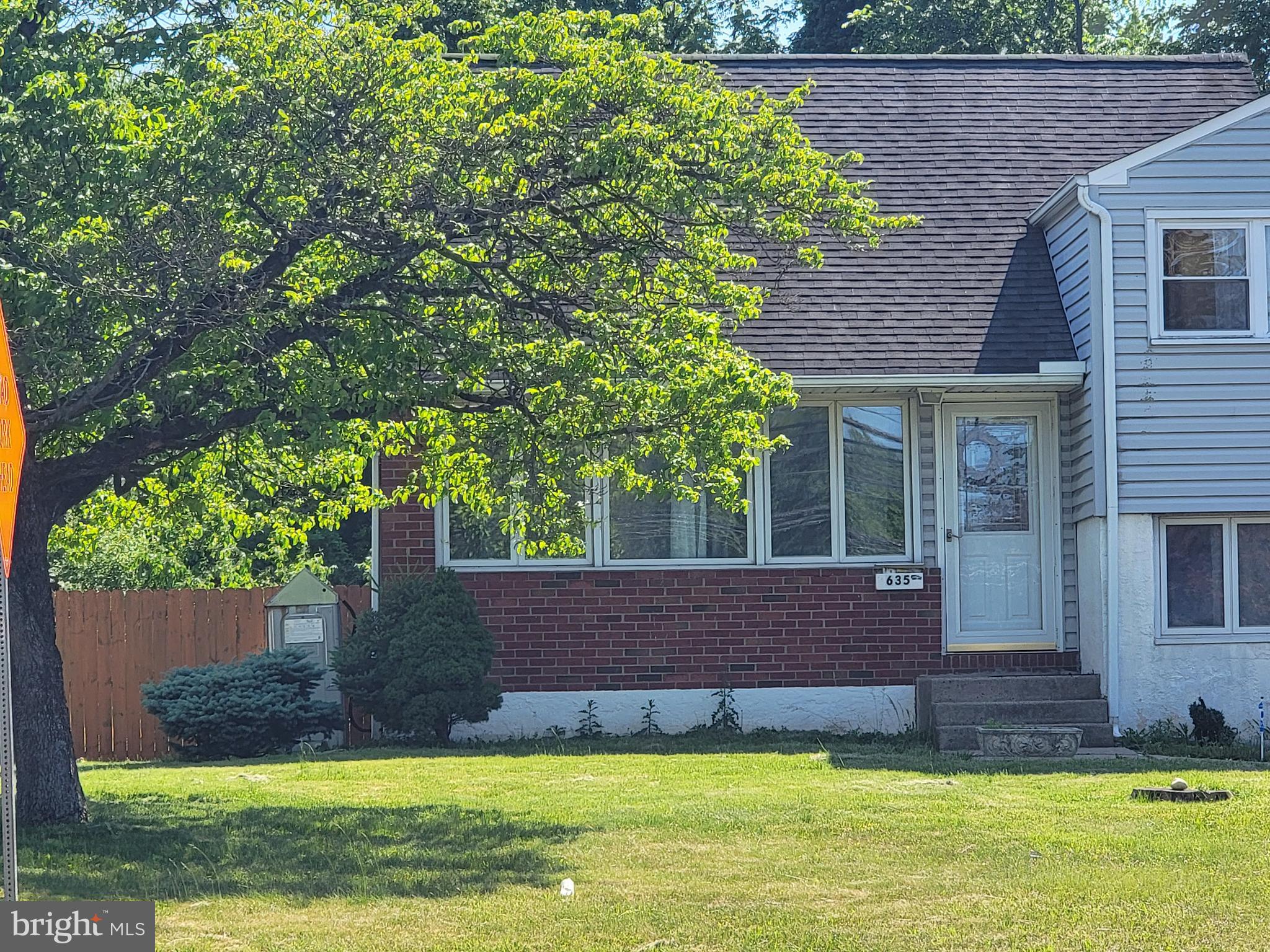 635 West County Line Road Hatboro, PA 19040 - Photo 2 of 10 a view of a house with a yard potted plants and large tree