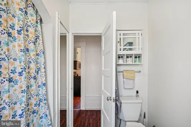 a bathroom with a shower and a sink