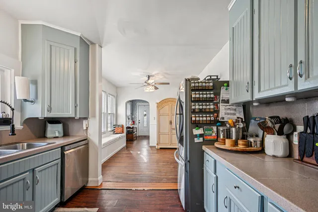 a kitchen with a refrigerator and a sink