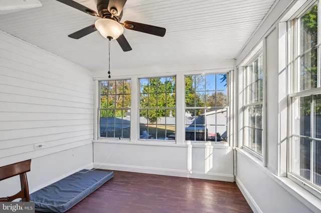 a view of an entryway with wooden floor