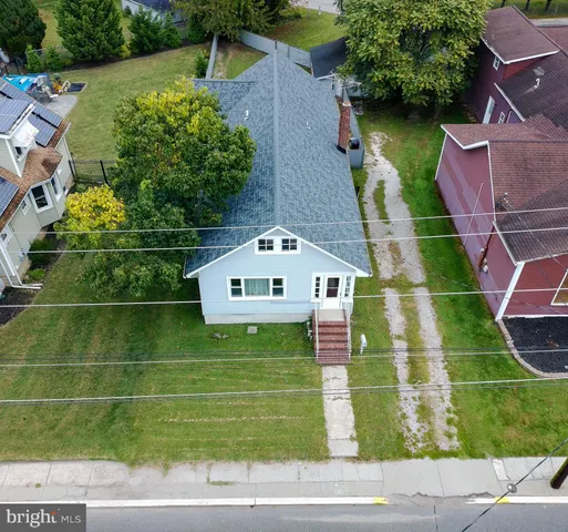 swimming pool view with a garden