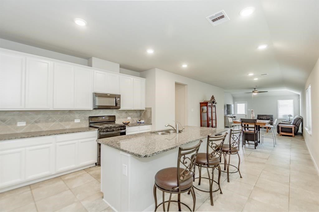 21423 Holly Heights Road Cypress, TX 77433 - Photo 5 of 12 a kitchen with lots of counter top space and appliances