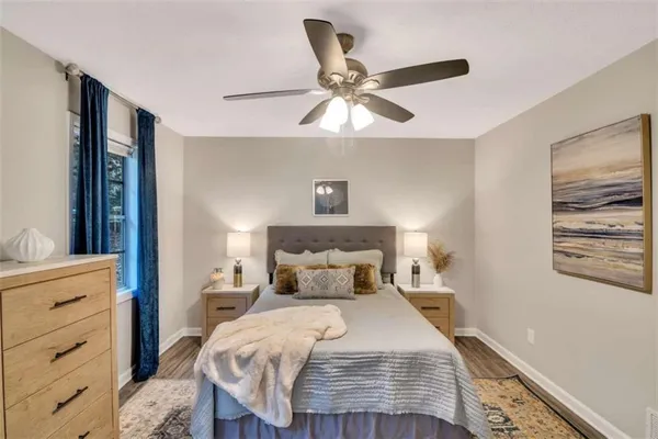 a bedroom with a bed and cabinet