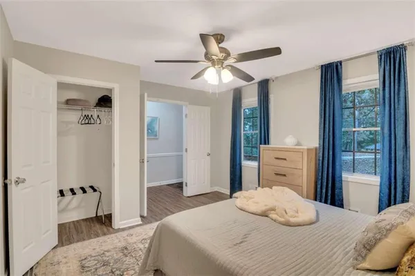 a bedroom with a bed and a dresser