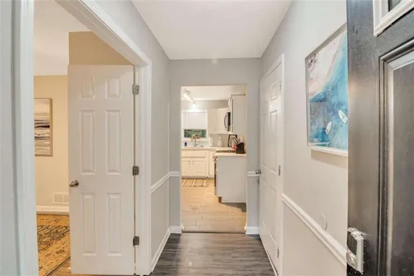 a bathroom with a sink and glass door