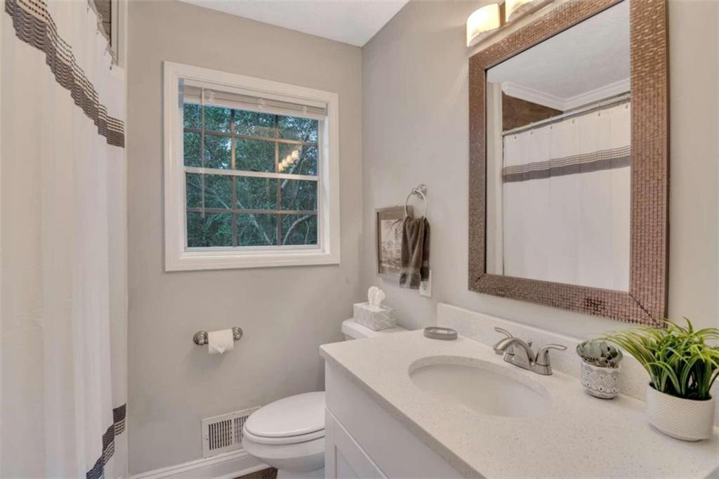 1504 Dupree Road Woodstock, GA 30189 - Photo 15 of 23 a bathroom with a sink toilet and tub