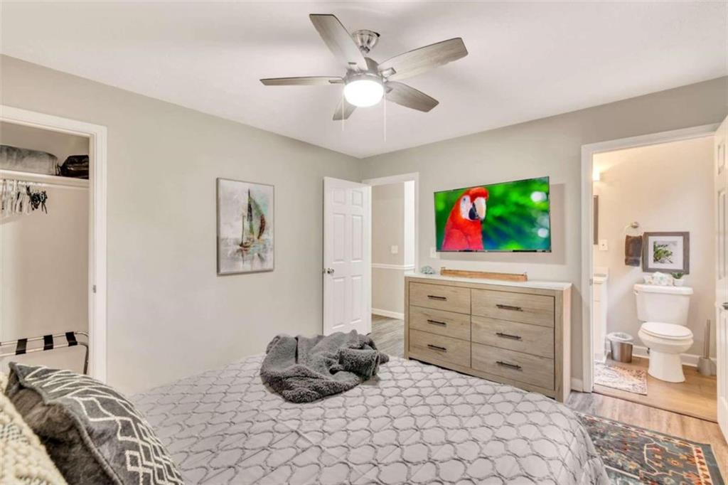 1504 Dupree Road Woodstock, GA 30189 - Photo 17 of 23 a bedroom with a bed and a flat screen tv