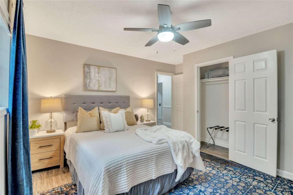 1504 Dupree Road Woodstock, GA 30189 - Photo 20 of 23 a bedroom with a bed and a chandelier