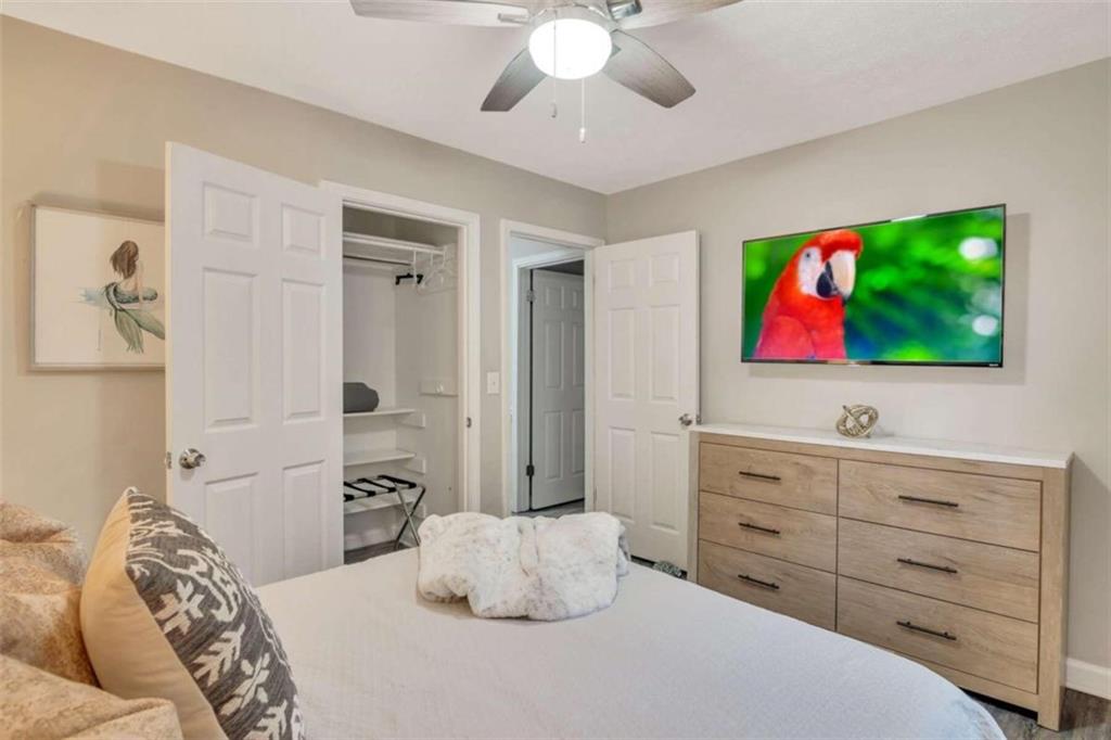 1504 Dupree Road Woodstock, GA 30189 - Photo 22 of 23 a bedroom with a bed and a flat screen tv